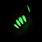 Neon green UV glowing nails in the dark