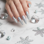 Dense holographic silver glitter nails with crystal snowflakes on white marble